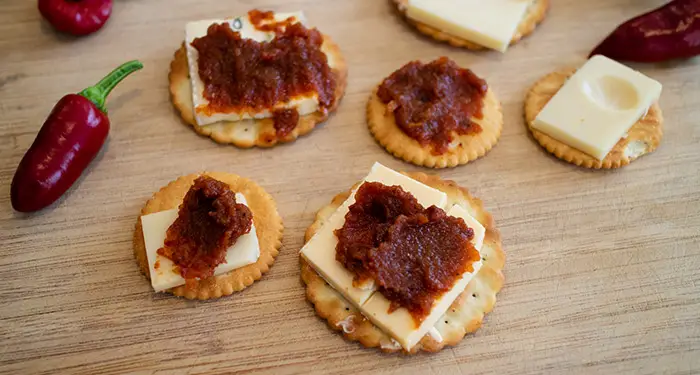 Some cheese crackers with the Smoky Tomato Chilli Chutney generously spread over the top